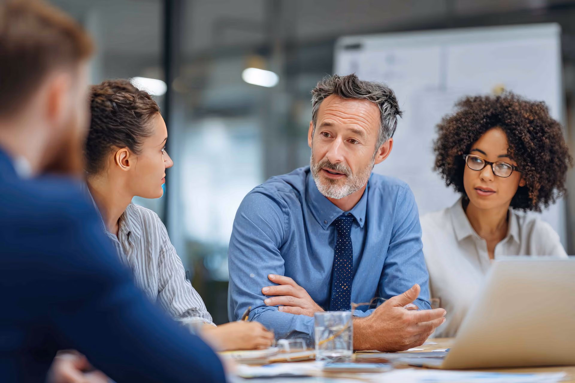 Businessman leads small team meeting