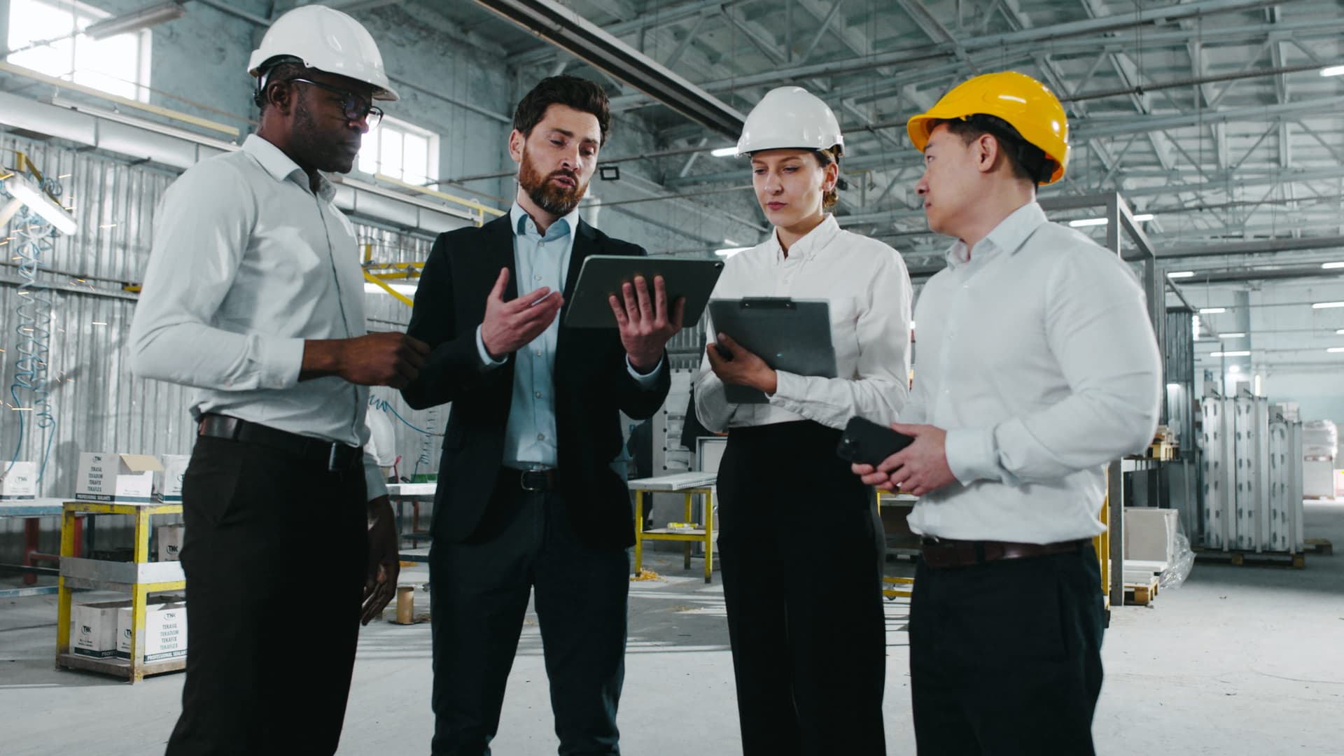 workers construction discussing building plan