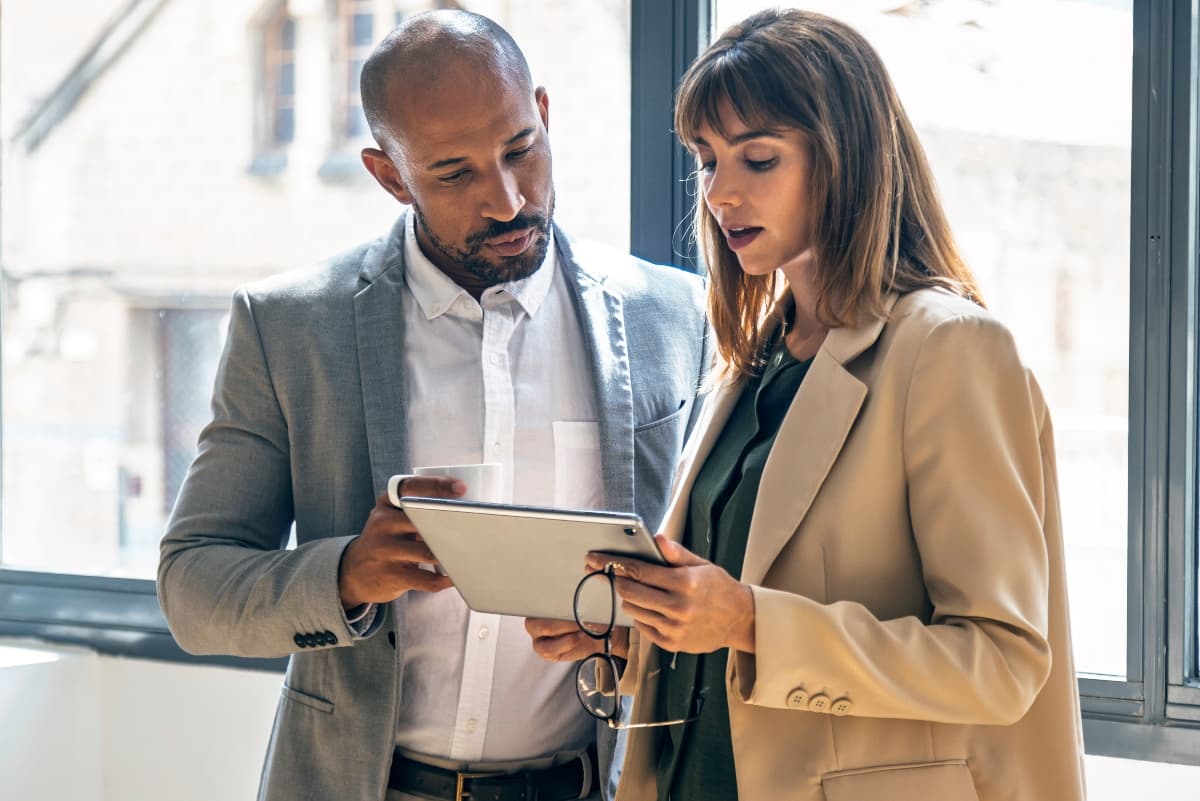 Business team discussing tablet