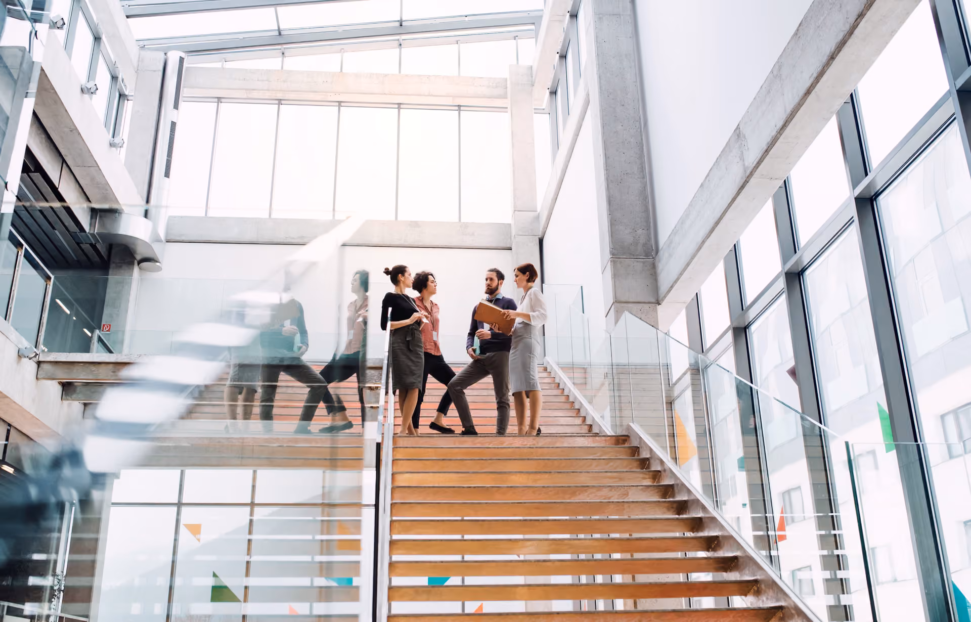 Upscale office building with team in staircase